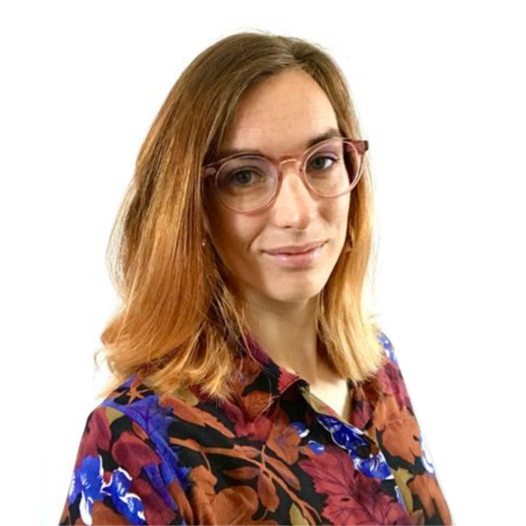 Image of Keren standing in front of a white background looking at the camera